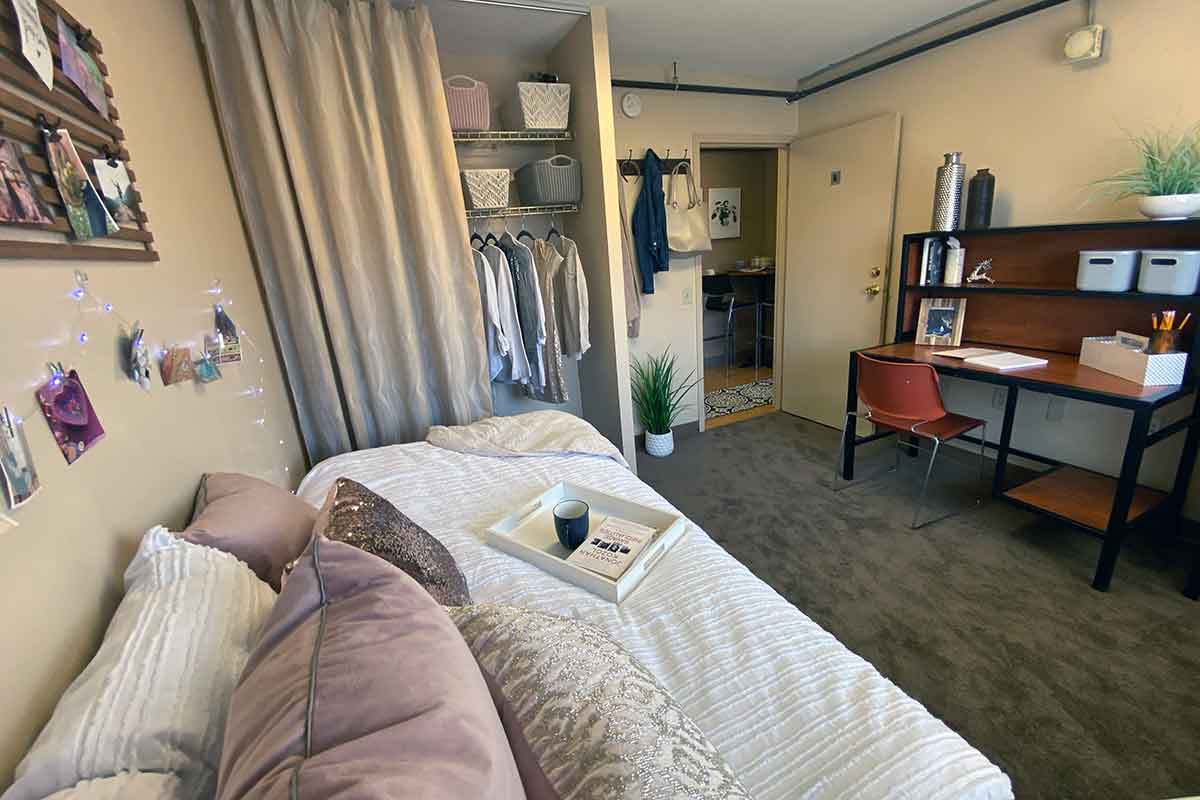 A furnished bedroom that has been decorated in the Highlander apartments