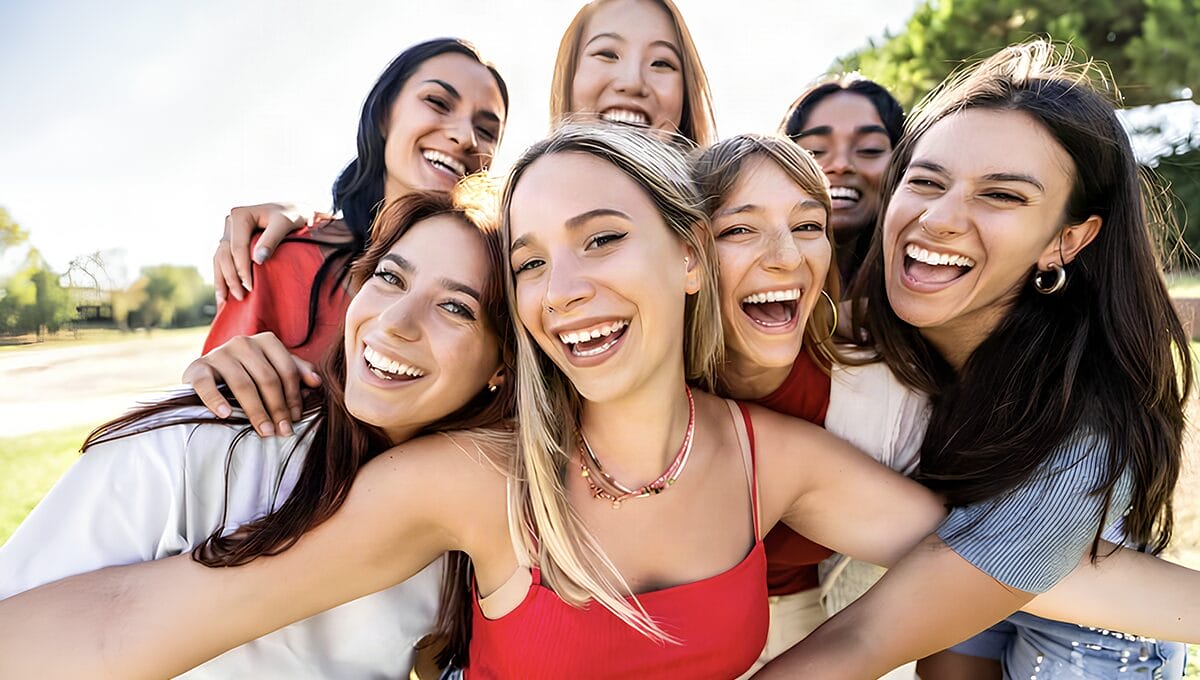 A group of young people smiling at the camera